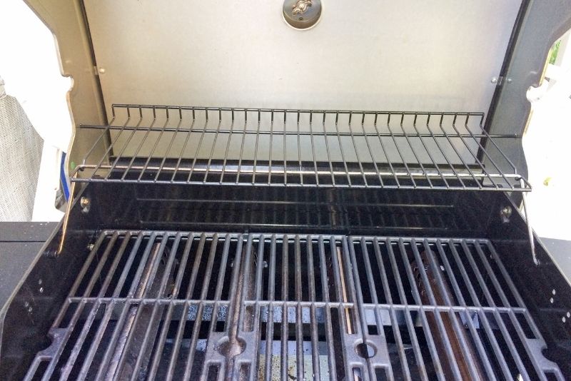 BBQ being cleaned
