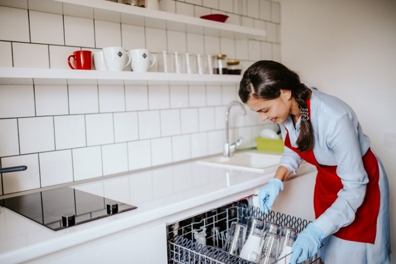 Clean glassware loaded into a dishwasher